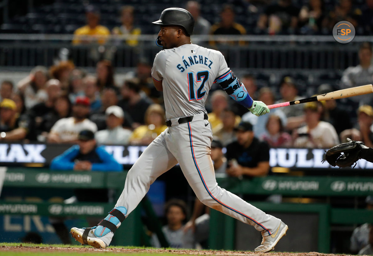 Sep 9, 2024; Pittsburgh, Pennsylvania, USA;  Miami Marlins right fielder Jesus Sanchez (12) hits a single against the Pittsburgh Pirates during the ninth inning at PNC Park. Pittsburgh won 3-2. Credit: Charles LeClaire-Imagn Images