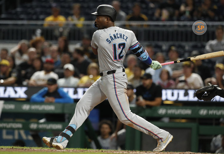 Sep 9, 2024; Pittsburgh, Pennsylvania, USA;  Miami Marlins right fielder Jesus Sanchez (12) hits a single against the Pittsburgh Pirates during the ninth inning at PNC Park. Pittsburgh won 3-2. Credit: Charles LeClaire-Imagn Images