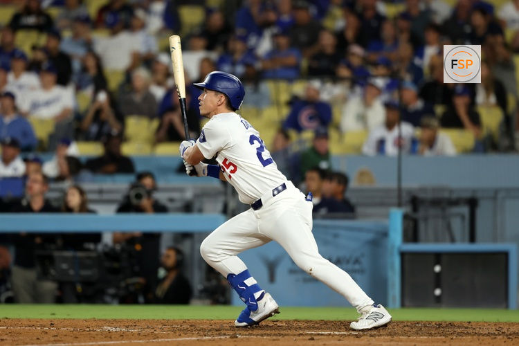Sep 11, 2024; Los Angeles, California, USA;  Los Angeles Dodgers center fielder Tommy Edman (25) hits a 2-run home run during the eighth inning against the Chicago Cubs at Dodger Stadium. Credit: Kiyoshi Mio-Imagn Images