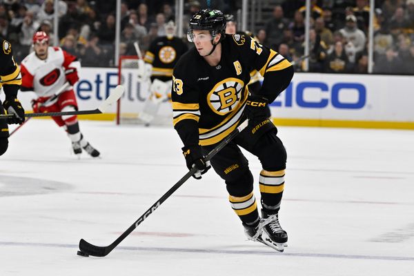 Nov 1, 2025; Boston, Massachusetts, USA; Boston Bruins defenseman Charlie McAvoy (73) skates with the puck during the third period against the Carolina Hurricanes at TD Garden. Mandatory Credit: Eric Canha-Imagn Images