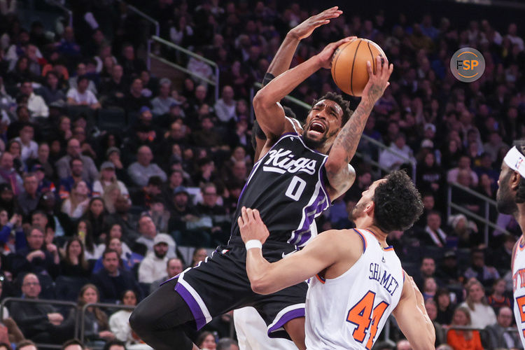 Jan 25, 2025; New York, New York, USA;  Sacramento Kings guard Malik Monk (0) drives to the basket against New York Knicks guard Landry Shamet (44) in the third quarter at Madison Square Garden. Credit: Wendell Cruz-Imagn Images