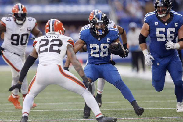 INDIANAPOLIS, IN - OCTOBER 22: Indianapolis Colts running back Jonathan Taylor (28) looks to get around Cleveland Browns safety Grant Delpit (22) during a NFL game between the Cleveland Browns and the Indianapolis Colts on October 22, 2023 at Lucas Oil Stadium in Indianapolis, IN.  (Photo by Jeffrey Brown/Icon Sportswire)