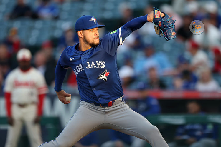 May 7, 2025; Anaheim, California, USA;  Toronto Blue Jays starting pitcher Jose Berrios (17) pitches during the first inning against the Los Angeles Angels at Angel Stadium. Credit: Kiyoshi Mio-Imagn Images