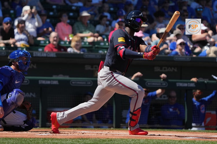 Mar 24, 2025; Mesa, Arizona, USA; Atlanta Braves outfielder Jurickson Profar (7) hits against the Chicago Cubs in the first inning at Sloan Park. Credit: Rick Scuteri-Imagn Images