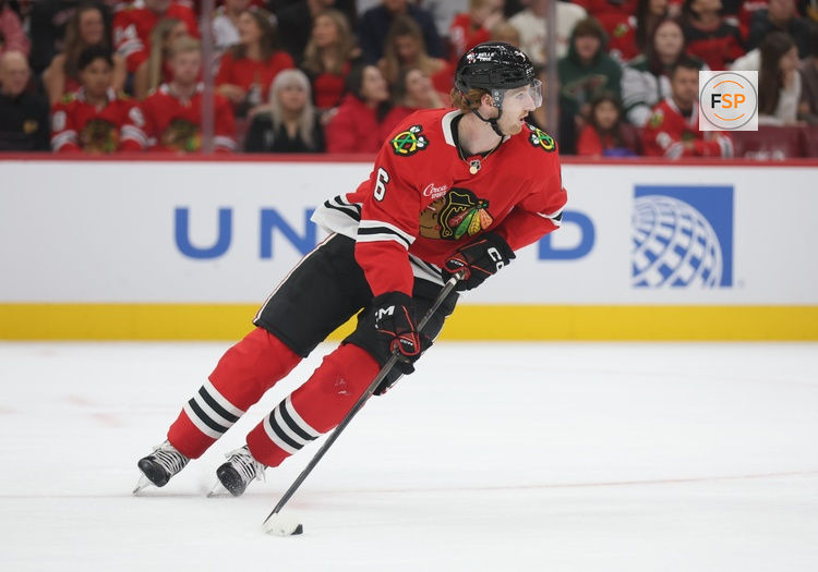 Oct 3, 2025; Chicago, Illinois, USA; Chicago Blackhawks defenseman Sam Rinzel (6) clears the puck during the second period against the Minnesota Wild at United Center. Credit: Talia Sprague-Imagn Images