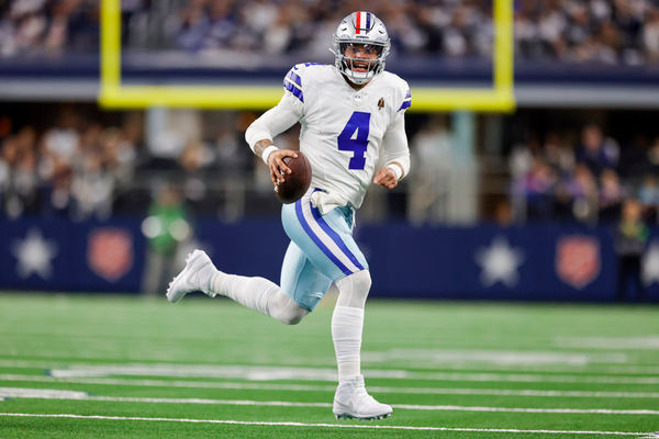 ARLINGTON, TX - NOVEMBER 12: Dallas Cowboys quarterback Dak Prescott (4) runs for a first down during the game between the Dallas Cowboys and the New York Giants on November 12, 2023 at AT&T Stadium in Arlington, Texas. (Photo by Matthew Pearce/Icon Sportswire)