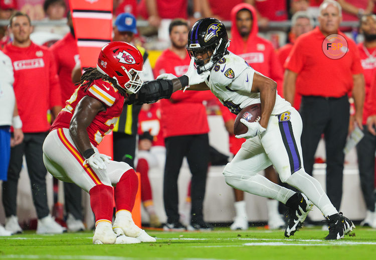 Sep 5, 2024; Kansas City, Missouri, USA; Baltimore Ravens tight end Isaiah Likely (80) runs with the ball against Kansas City Chiefs linebacker Nick Bolton (32) during the second half at GEHA Field at Arrowhead Stadium. Credit: Jay Biggerstaff-Imagn Images