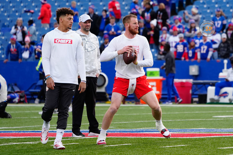 Nov 17, 2024; Orchard Park, New York, USA; Kansas City Chiefs quarterback Carson Wentz (11) warms up with Kansas City Chiefs quarterback Patrick Mahomes (15) prior to the game against the Buffalo Bills at Highmark Stadium. Credit: Gregory Fisher-Imagn Images