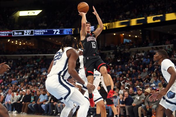 Nov 5, 2025; Memphis, Tennessee, USA; Houston Rockets guard Reed Sheppard (15) shoots during the third quarter against the Memphis Grizzlies at FedExForum. Mandatory Credit: Petre Thomas-Imagn Images