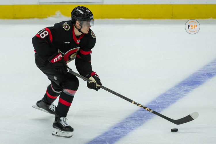 Jan 25, 2025; Ottawa, Ontario, CAN; Ottawa Senators center Tim Stutzle (18) skates with the puck against the Toronto Maple Leafs in the third period at the Canadian Tire Centre. Credit: Marc DesRosiers-Imagn Images