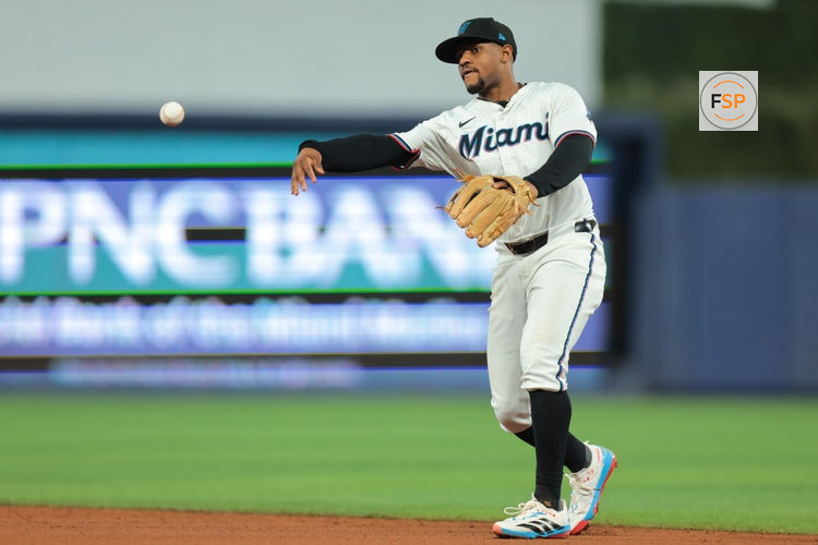 Jul 23, 2025; Miami, Florida, USA; Miami Marlins shortstop Xavier Edwards (9) throws to first base to retire San Diego Padres center fielder Tyler Wade (not pictured) during the third inning at loanDepot Park. Credit: Sam Navarro-Imagn Images
