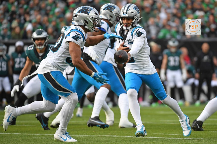 Dec 8, 2024; Philadelphia, Pennsylvania, USA; Carolina Panthers quarterback Bryce Young (9) hands off to running back Chuba Hubbard (30) against the Philadelphia Eagles at Lincoln Financial Field. Credit: Eric Hartline-Imagn Images