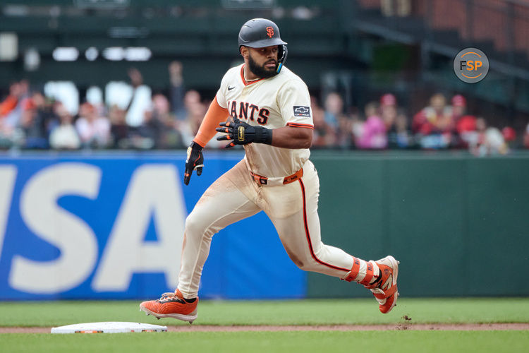 Apr 27, 2025; San Francisco, California, USA; San Francisco Giants outfielder Heliot Ramos (17) runs toward second base against the Texas Rangers during the ninth inning at Oracle Park. Credit: Robert Edwards-Imagn Images