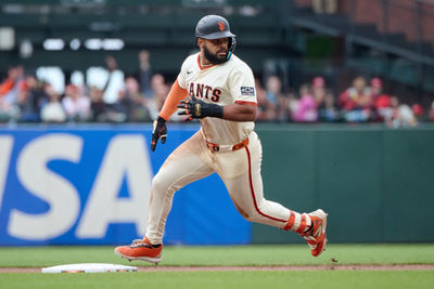 Apr 27, 2025; San Francisco, California, USA; San Francisco Giants outfielder Heliot Ramos (17) runs toward second base against the Texas Rangers during the ninth inning at Oracle Park. Mandatory Credit: Robert Edwards-Imagn Images