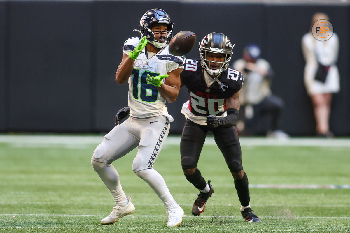 Oct 20, 2024; Atlanta, Georgia, USA; Seattle Seahawks wide receiver Tyler Lockett (16) catches a pass in front of Atlanta Falcons cornerback Dee Alford (20) in the fourth quarter at Mercedes-Benz Stadium. Credit: Brett Davis-Imagn Images