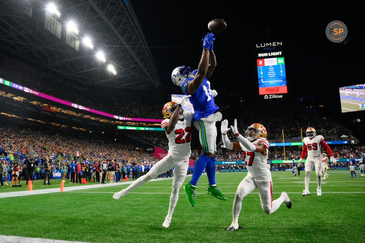 Oct 10, 2024; Seattle, Washington, USA; San Francisco 49ers cornerback Isaac Yiadom (22) and safety Ji'Ayir Brown (27) break up a touchdown pass intended for Seattle Seahawks wide receiver DK Metcalf (14) during the second half at Lumen Field. Credit: Steven Bisig-Imagn Images