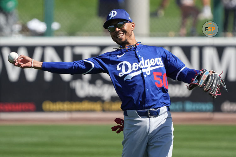 Mar 2, 2025; Mesa, Arizona, USA; Los Angeles Dodgers shortstop Mookie Betts (50) gets ready for a game against the Oakland Athletics at Hohokam Stadium. Credit: Rick Scuteri-Imagn Images