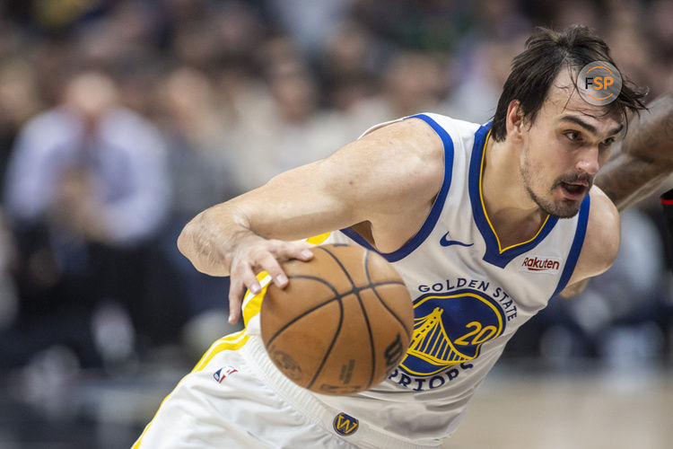 LOS ANGELES, CA - DECEMBER 02: Golden State Warriors center Dario Saric (20) drives under the basket in the second half of an NBA basketball game between the Golden State Warriors and Los Angeles Clippers, Saturday, December 2, 2023, at Crypto.com Arena in Los Angeles, California. (Photo by Tony Ding/Icon Sportswire)