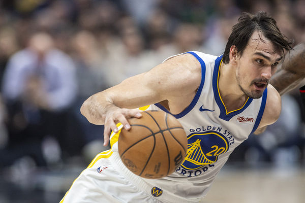 LOS ANGELES, CA - DECEMBER 02: Golden State Warriors center Dario Saric (20) drives under the basket in the second half of an NBA basketball game between the Golden State Warriors and Los Angeles Clippers, Saturday, December 2, 2023, at Crypto.com Arena in Los Angeles, California. (Photo by Tony Ding/Icon Sportswire)