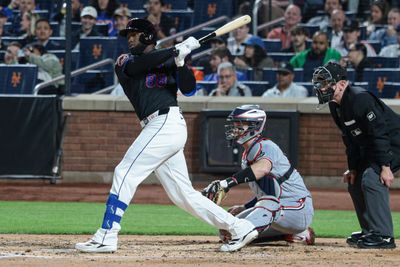 Apr 23, 2026; New York City, New York, USA;  New York Mets center fielder Luis Robert Jr. (88) hits an RBI double during the second inning against the Minnesota Twins at Citi Field. Mandatory Credit: Vincent Carchietta-Imagn Images