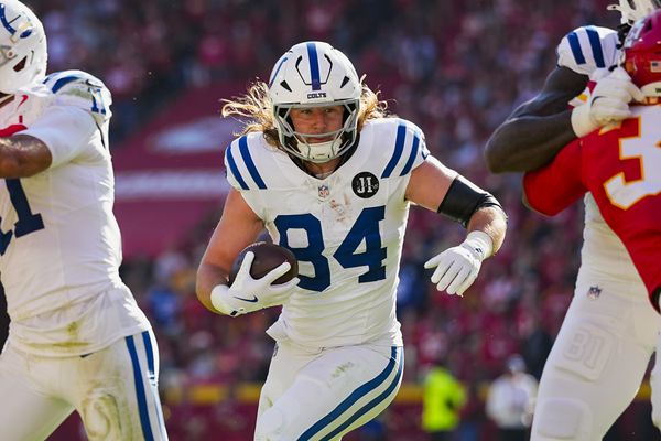 Nov 23, 2025; Kansas City, Missouri, USA; Indianapolis Colts tight end Tyler Warren (84) runs with the ball during the first half against the Kansas City Chiefs at GEHA Field at Arrowhead Stadium. Mandatory Credit: Jay Biggerstaff-Imagn Images