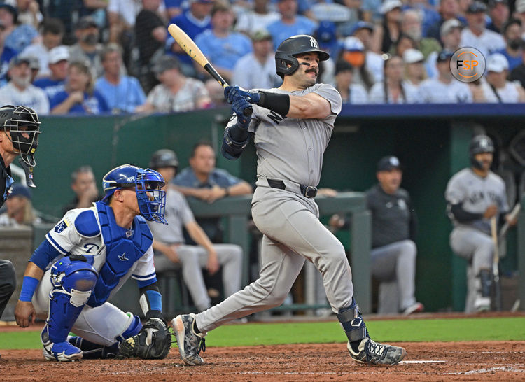 Jun 10, 2025; Kansas City, Missouri, USA;  New York Yankees catcher Austin Wells (28) drives in two runs with a double in the sixth inning against the Kansas City Royals at Kauffman Stadium. Credit: Peter Aiken-Imagn Images