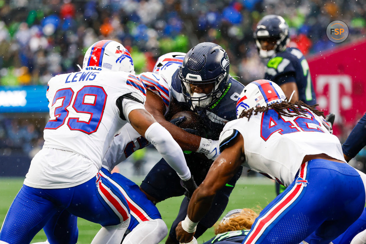 Oct 27, 2024; Seattle, Washington, USA; Seattle Seahawks running back Kenneth Walker III (9) rushes against the Buffalo Bills during the second quarter at Lumen Field. Credit: Joe Nicholson-Imagn Images