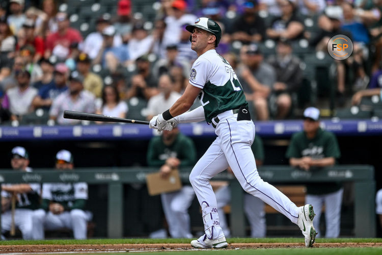 DENVER, CO - JUNE 10: Colorado Rockies first baseman Nolan Jones (22) hits a second inning solo homerun during a game between the San Diego Padres and the Colorado Rockies at Coors Field on June 10, 2023 in Denver, Colorado. (Photo by Dustin Bradford/Icon Sportswire)