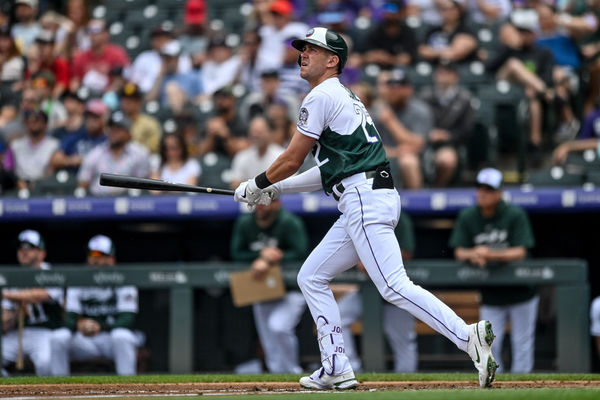DENVER, CO - JUNE 10: Colorado Rockies first baseman Nolan Jones (22) hits a second inning solo homerun during a game between the San Diego Padres and the Colorado Rockies at Coors Field on June 10, 2023 in Denver, Colorado. (Photo by Dustin Bradford/Icon Sportswire)