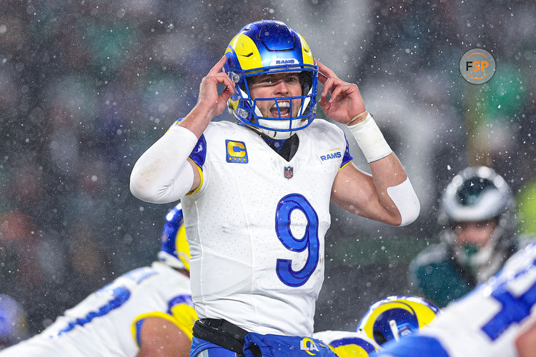 Jan 19, 2025; Philadelphia, Pennsylvania, USA; Los Angeles Rams quarterback Matthew Stafford (9) calls a play at the one of scrimmage against the Philadelphia Eagles in a 2025 NFC divisional round game at Lincoln Financial Field. Credit: Bill Streicher-Imagn Images