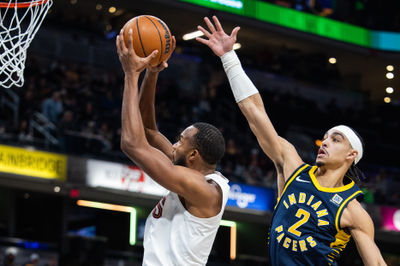 Jan 14, 2025; Indianapolis, Indiana, USA; Cleveland Cavaliers forward Evan Mobley (4) shoots the ball while Indiana Pacers guard Andrew Nembhard (2) defends in the first half at Gainbridge Fieldhouse. Mandatory Credit: Trevor Ruszkowski-Imagn Images