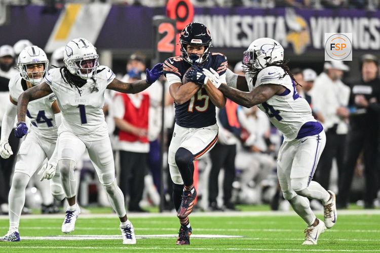 Dec 16, 2024; Minneapolis, Minnesota, USA; Chicago Bears wide receiver Rome Odunze (15) gets yards after catch as Minnesota Vikings safety Josh Metellus (right) and cornerback Shaquill Griffin (1) and safety Camryn Bynum (24) defend during the third quarter at U.S. Bank Stadium. Credit: Jeffrey Becker-Imagn Images