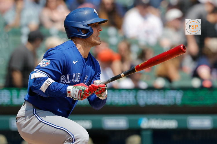 May 16, 2026; Detroit, Michigan, USA; Toronto Blue Jays center fielder Daulton Varsho (5) hits an RBI triple in the third inning against the Detroit Tigers at Comerica Park. Credit: Rick Osentoski-Imagn Images