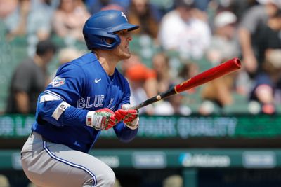 May 16, 2026; Detroit, Michigan, USA; Toronto Blue Jays center fielder Daulton Varsho (5) hits an RBI triple in the third inning against the Detroit Tigers at Comerica Park. Mandatory Credit: Rick Osentoski-Imagn Images