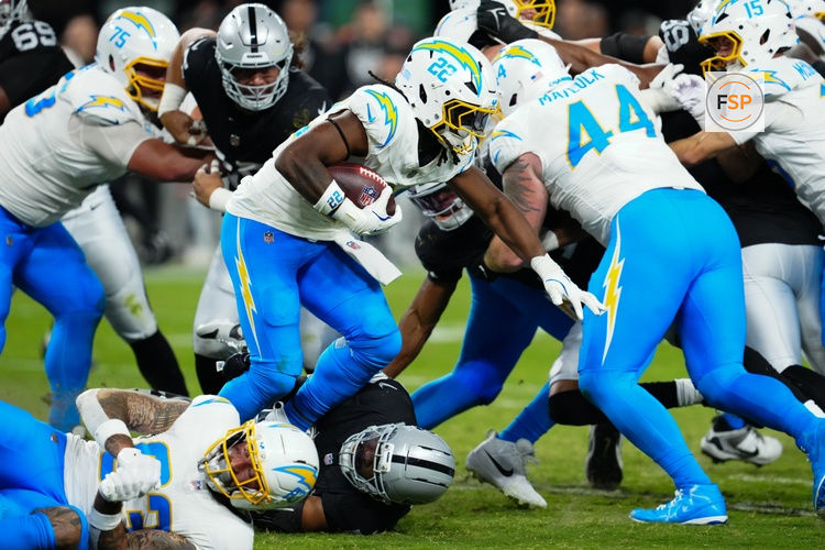 Sep 15, 2025; Paradise, Nevada, USA; Los Angeles Chargers running back Najee Harris (22) rushes the ball during the second quarter against the Las Vegas Raiders at Allegiant Stadium. Credit: Stephen R. Sylvanie-Imagn Images