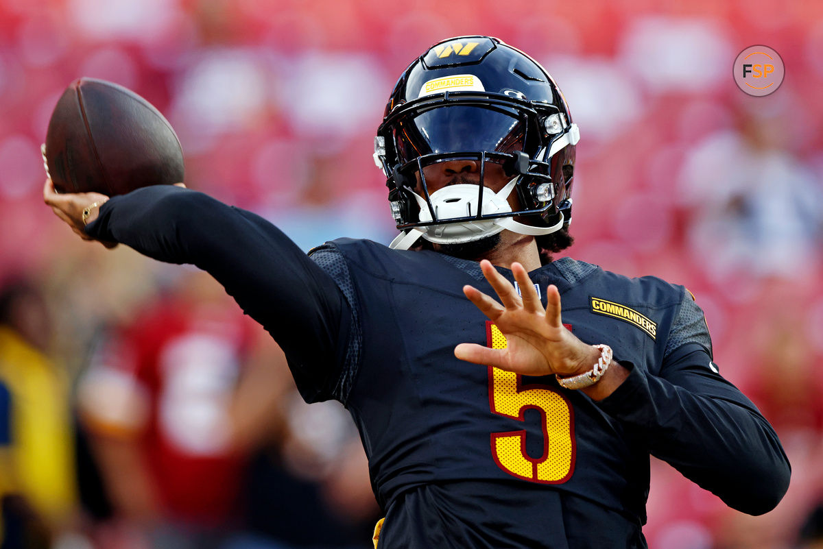 Aug 25, 2024; Landover, Maryland, USA; Washington Commanders quarterback Jayden Daniels (5) warms up before playing a preseason game against the New England Patriots at Commanders Field. Credit: Peter Casey-USA TODAY Sports