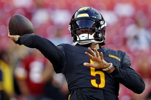 Aug 25, 2024; Landover, Maryland, USA; Washington Commanders quarterback Jayden Daniels (5) warms up before playing a preseason game against the New England Patriots at Commanders Field. Mandatory Credit: Peter Casey-USA TODAY Sports