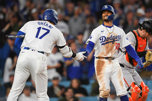 LOS ANGELES, CA - APRIL 02: Los Angeles Dodgers shortstop Mookie Betts (50) celebrates with Los Angeles Dodgers designated hitter Shohei Ohtani (17) after hitting a home run during the MLB game between the San Francisco Giants and the Los Angeles Dodgers on April 2, 2024 at Dodger Stadium in Los Angeles, CA. (Photo by Brian Rothmuller/Icon Sportswire)
