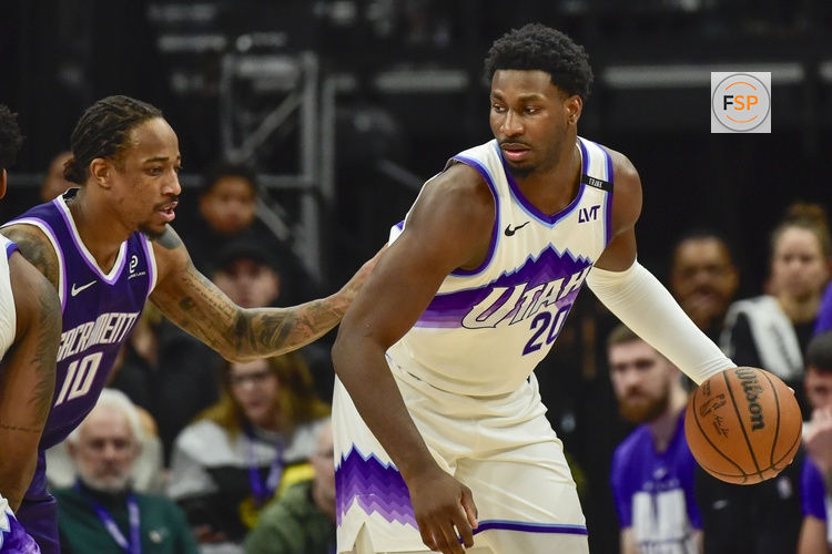 Feb 11, 2026; Salt Lake City, Utah, USA; Utah Jazz forward Jaren Jackson Jr. (20) plans his next move around Sacramento Kings guard/forward DeMar DeRozan (10) during the first half at Delta Center. Credit: Peter Creveling-Imagn Images