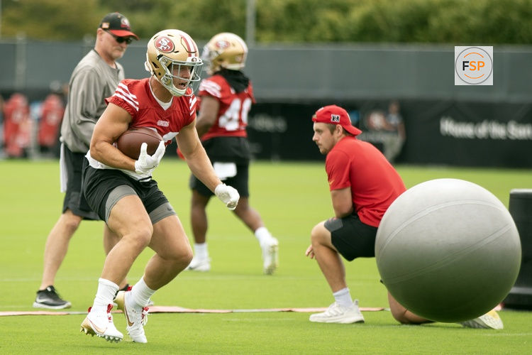 Jul 24, 2025; Santa Clara, CA, USA; San Francisco 49ers running back Christian McCaffrey (23) runs through an obstacle course during the second day of training camp. Credit: D. Ross Cameron-Imagn Images