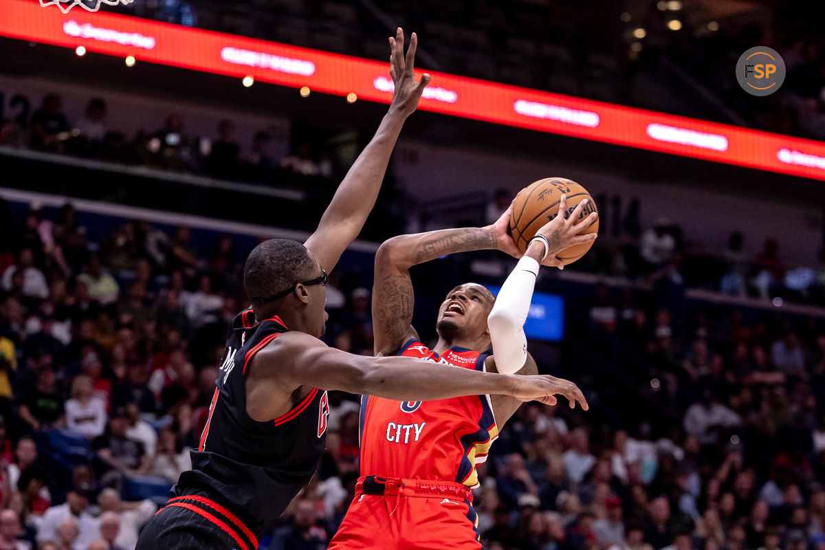 Oct 23, 2024; New Orleans, Louisiana, USA;  New Orleans Pelicans guard Dejounte Murray (5) shoots a jump shot against Chicago Bulls forward Jalen Smith (7) during the second half at Smoothie King Center. Credit: Stephen Lew-Imagn Images