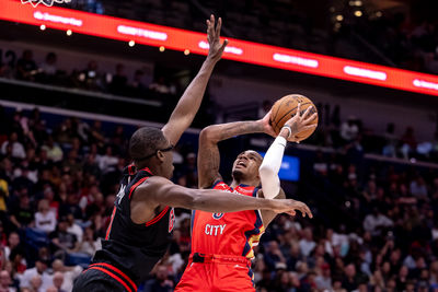 Oct 23, 2024; New Orleans, Louisiana, USA;  New Orleans Pelicans guard Dejounte Murray (5) shoots a jump shot against Chicago Bulls forward Jalen Smith (7) during the second half at Smoothie King Center. Mandatory Credit: Stephen Lew-Imagn Images