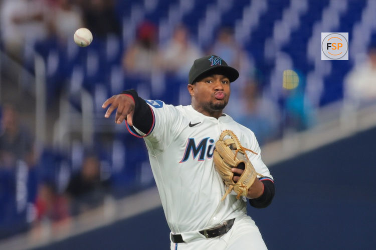 Apr 21, 2025; Miami, Florida, USA; Miami Marlins shortstop Xavier Edwards (9) throws to first base to retire Cincinnati Reds left fielder Spencer Steer (not pictured) during the seventh inning at loanDepot Park. Credit: Sam Navarro-Imagn Images