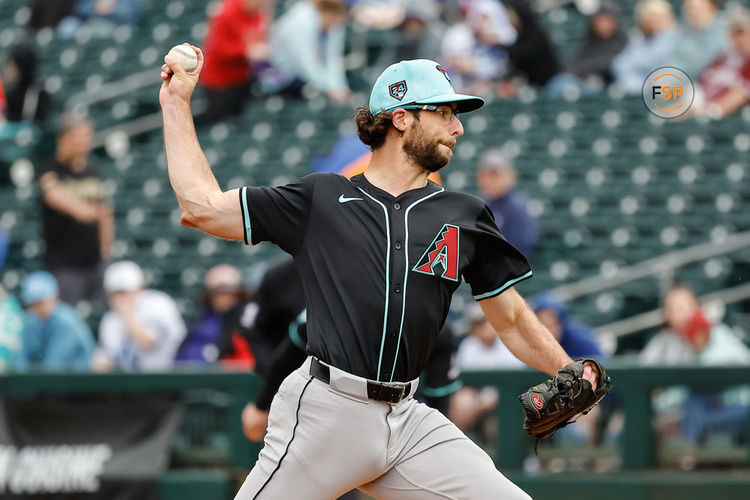 SURPRISE, AZ - MARCH 07:  Arizona Diamondbacks starting pitcher Zac Gallen (23) pitches during the MLB spring training baseball game between the Arizona Diamondbacks and the Texas Rangers on March 7, 2024 at Surprise Stadium in Surprise, Arizona. (Photo by Kevin Abele/Icon Sportswire)