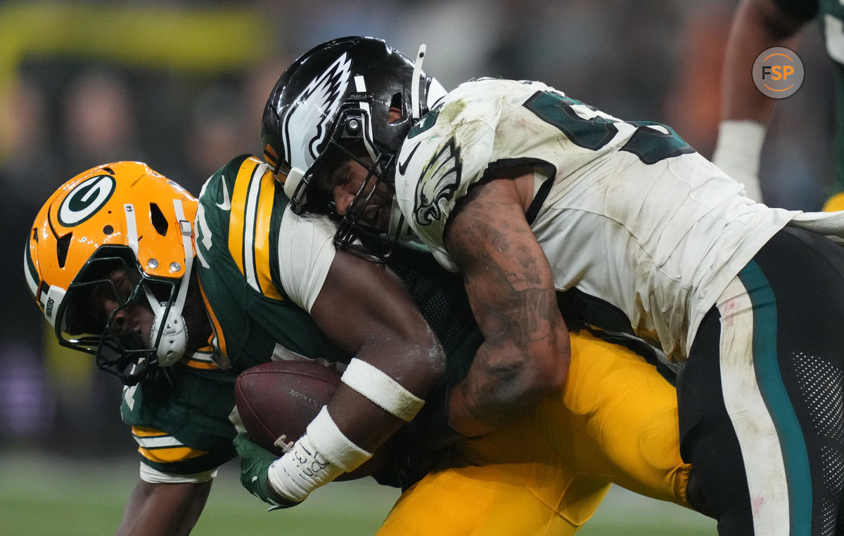 Sep 6, 2024; Sao Paulo, BRA; Philadelphia Eagles linebacker Zack Baun (53) tackles Green Bay Packers running back Emanuel Wilson (31) during the second half at Neo Quimica Arena. Credit: Kirby Lee-Imagn Images