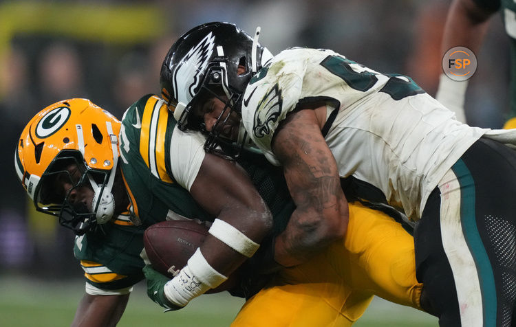 Sep 6, 2024; Sao Paulo, BRA; Philadelphia Eagles linebacker Zack Baun (53) tackles Green Bay Packers running back Emanuel Wilson (31) during the second half at Neo Quimica Arena. Credit: Kirby Lee-Imagn Images