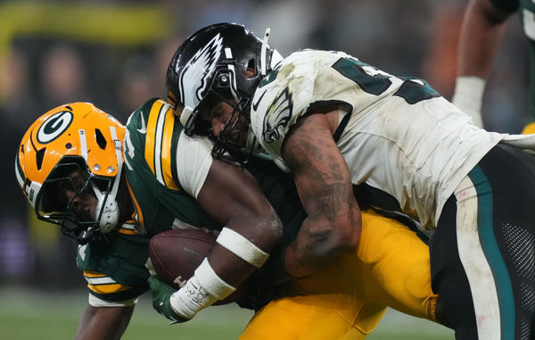 Sep 6, 2024; Sao Paulo, BRA; Philadelphia Eagles linebacker Zack Baun (53) tackles Green Bay Packers running back Emanuel Wilson (31) during the second half at Neo Quimica Arena. Mandatory Credit: Kirby Lee-Imagn Images