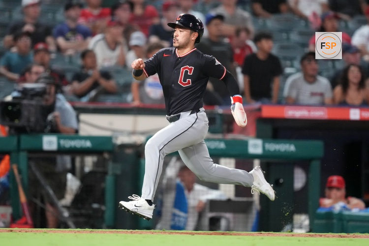 Aug 25, 2026; Anaheim, California, USA; Cleveland Guardians designated hitter Steven Kwan (38) scores in the eighth inning against the Los Angeles Angels at Angel Stadium. Credit: Kirby Lee-Imagn Images