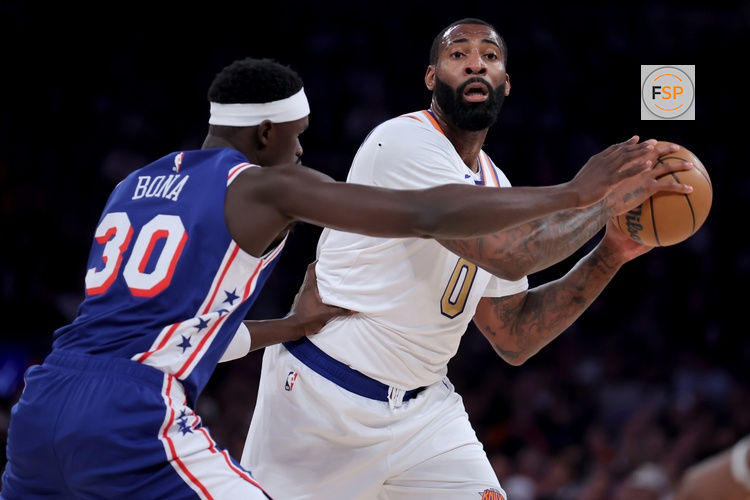 Oct 20, 2026; New York, New York, USA; New York Knicks center Andre Drummond (0) looks to pass the ball against Philadelphia 76ers center Adem Bona (30) during the first quarter at Madison Square Garden. Credit: Brad Penner-Imagn Images