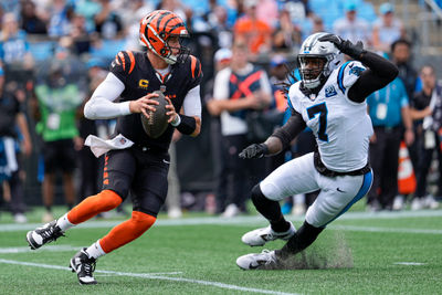 Sep 29, 2024; Charlotte, North Carolina, USA; Carolina Panthers linebacker Jadeveon Clowney (7) pressures Cincinnati Bengals quarterback Joe Burrow (9) during 1st quarter at Bank of America Stadium. Mandatory Credit: Jim Dedmon-Imagn Images